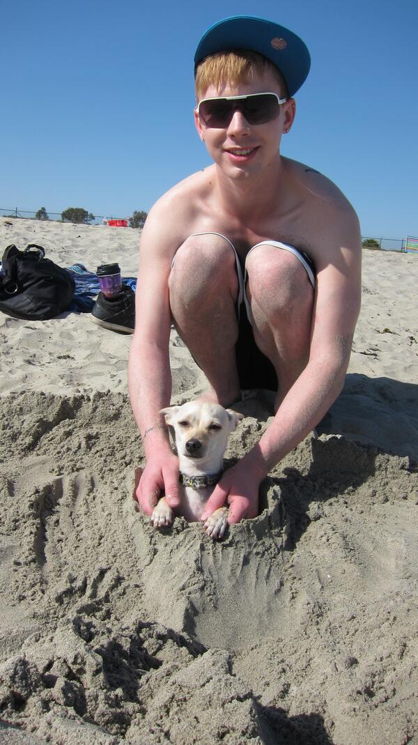 Kyler Ash with his beach doggie