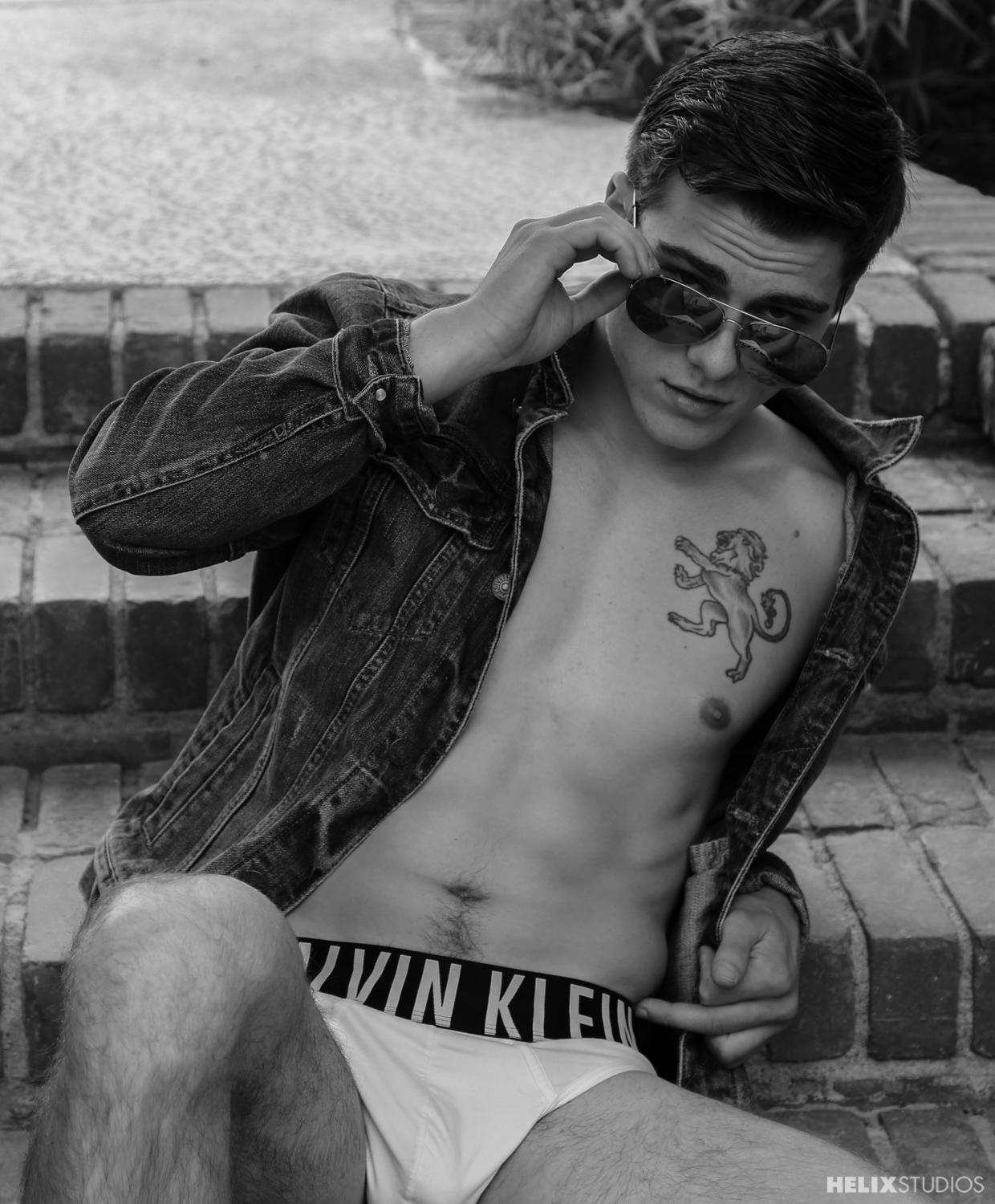 Black and white pic of Blake Mitchell in sunglasses and underwear